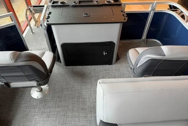 Slide: The Image of Interior of 2026 Sun Tracker SportFish 22 XP3 pontoon boat with seating and console. - 3