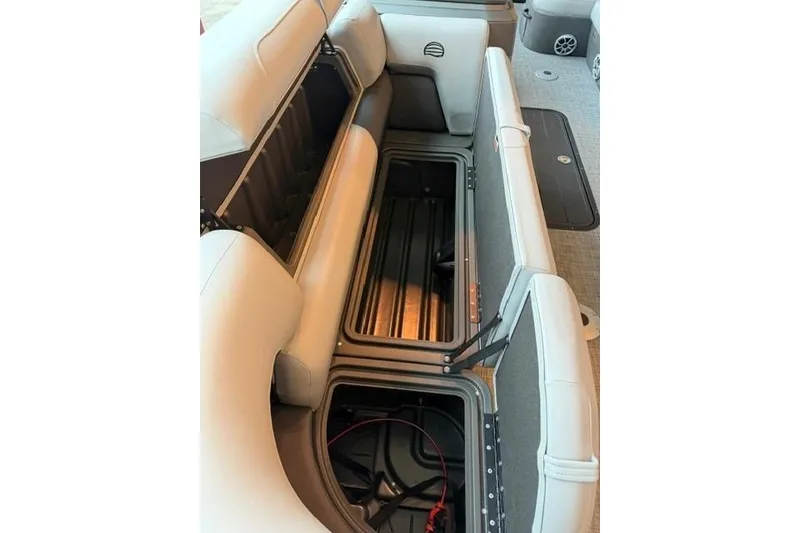Slide: The Image of 2026 Sun Tracker SportFish 22 XP3 boat interior with open storage compartments. - 6
