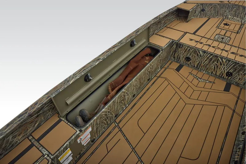 Slide: The Image of 2026 Tracker Grizzly 1756 T Marsh boat interior with storage compartment and deck. - 17