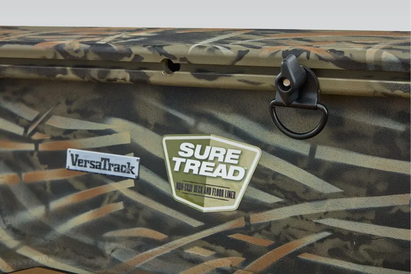 Slide: The Image of 2026 Tracker Grizzly 1756 T Marsh boat interior with open storage compartment. - 19