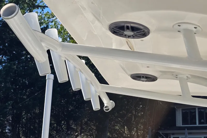 Slide: The Image of 2022 Sea Fox 249 Avenger boat with rod holders and speakers, viewed from below. - 11