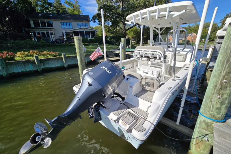 Slide: The Image of 2022 Sea Fox 249 Avenger boat docked, featuring a powerful 250 engine and sleek design. - 13