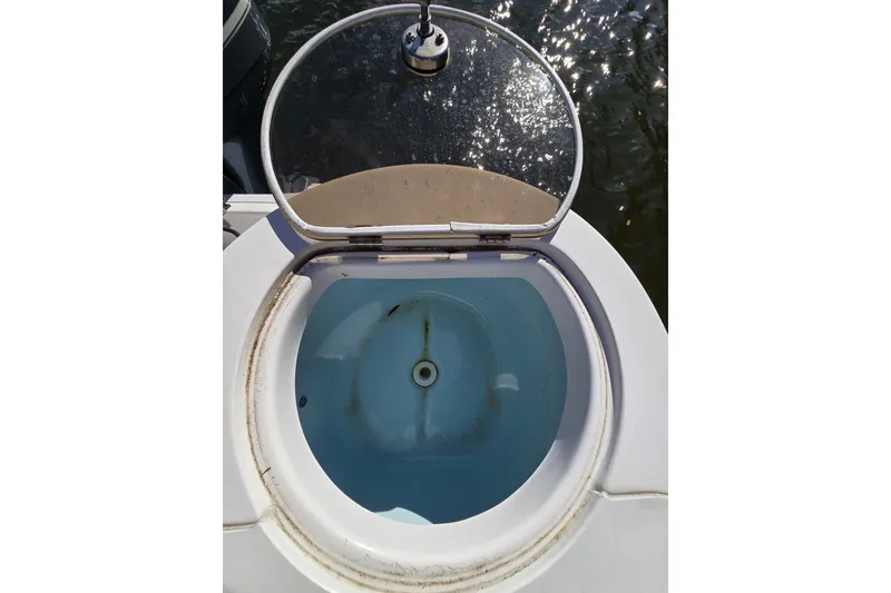 Slide: The Image of Livewell on 2022 Sea Fox 249 Avenger boat, open lid, water visible. - 19