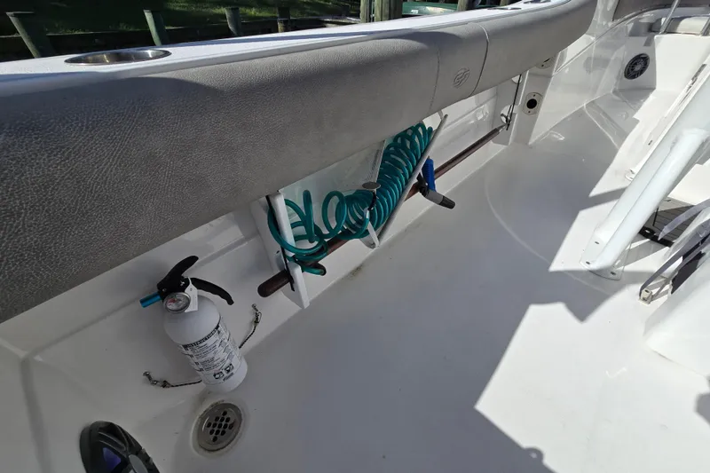 Slide: The Image of 2022 Sea Fox 249 Avenger boat interior with hose and fire extinguisher. - 20