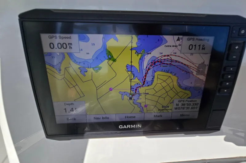 Slide: The Image of Garmin GPS display on 2022 Sea Fox 249 Avenger, showing navigation map and coordinates. - 26