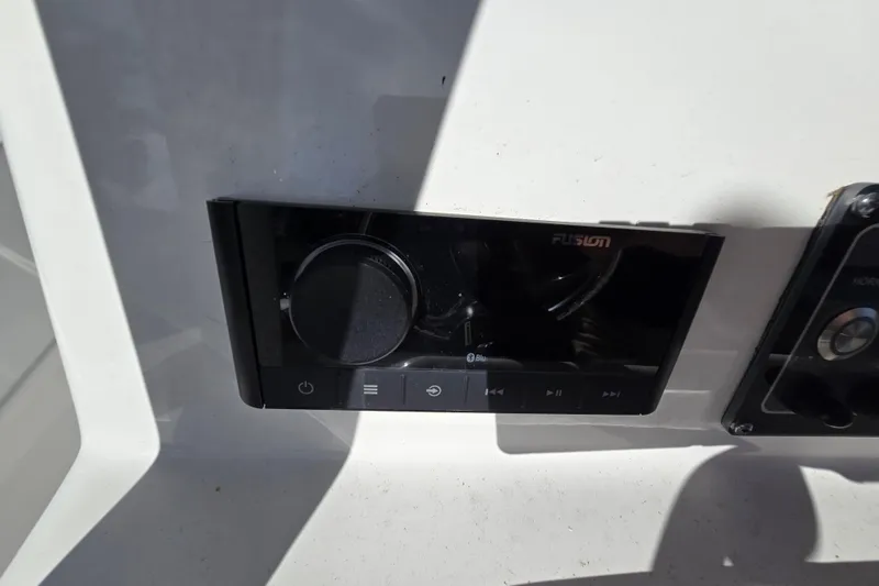 Slide: The Image of Fusion audio system on 2022 Sea Fox 249 Avenger boat dashboard. - 27