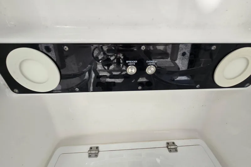 Slide: The Image of Control panel of 2022 Sea Fox 249 Avenger boat with light switches. - 30