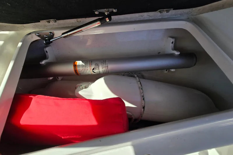 Slide: The Image of Storage compartment in 2022 Sea Fox 249 Avenger boat with safety equipment. - 37