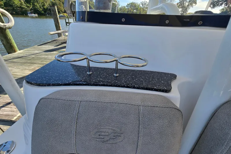 Slide: The Image of 2022 Sea Fox 249 Avenger boat interior with cup holders and seating. - 39