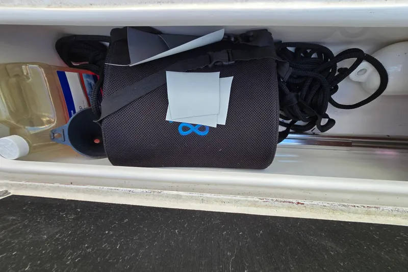 Slide: The Image of Storage compartment in 2022 Sea Fox 249 Avenger boat with gear and supplies. - 45