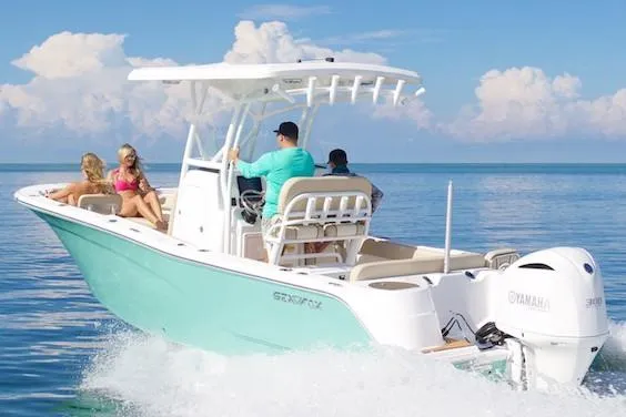 Slide: The Image of Manufacturer Provided Image: 2022 Sea Fox 249 Avenger boat cruising on clear blue water with passengers. - 46