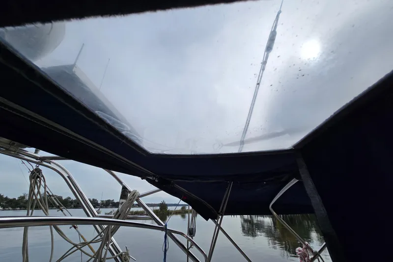 Slide: The Image of Cockpit of 2001 Island Packet 420 sailboat with navigation equipment and Lifesling safety gear. - 19