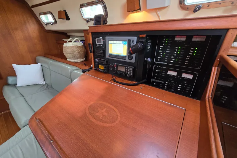 Slide: The Image of Interior of a 2001 Island Packet 420 yacht with navigation equipment and seating area. - 45