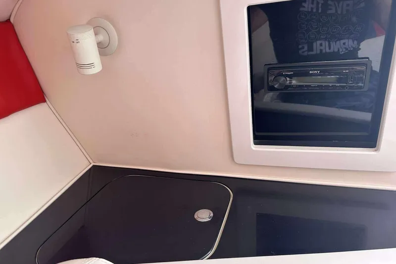 Slide: The Image of Interior of 2006 Donzi 26 boat with Sony stereo system and sleek design. - 14