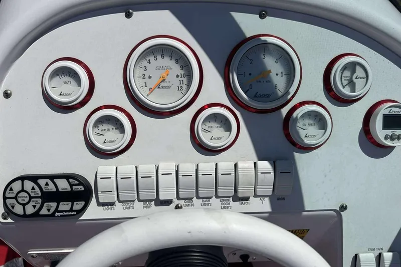 Slide: The Image of Dashboard of a 2006 Donzi 26 boat with Livorsi gauges and controls. - 9