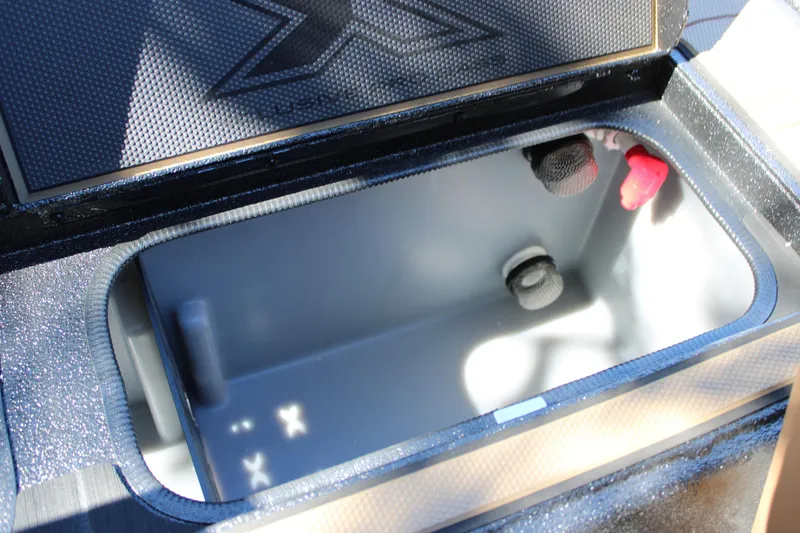 Slide: The Image of Open storage compartment in 2026 Xpress X21 Pro boat. - 12