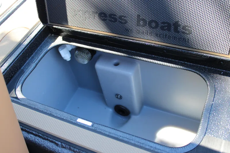 Slide: The Image of Open storage compartment in 2026 Xpress X21 Pro boat. - 13