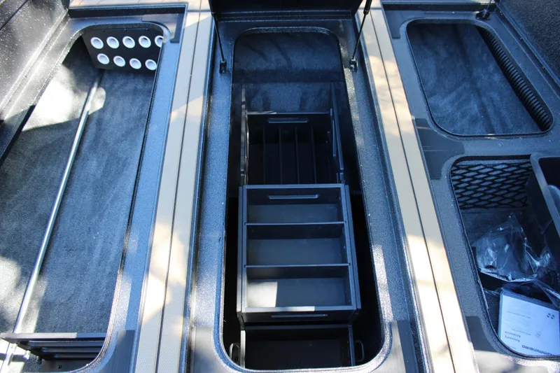 Slide: The Image of Interior storage compartments of 2026 Xpress X21 Pro boat, featuring organized sections. - 15