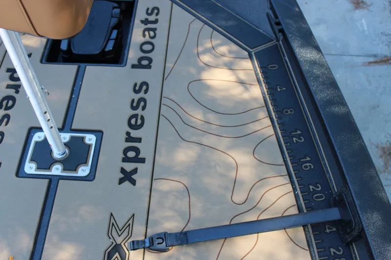 Slide: The Image of Xpress X21 Pro 2026 boat deck with measuring ruler and seat mount. - 19