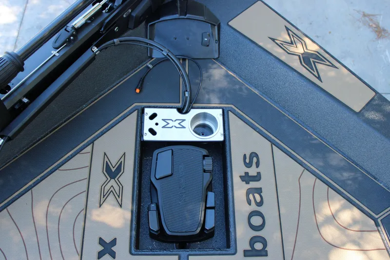 Slide: The Image of Xpress X21 Pro 2026 boat deck with pedal and logo detailing. - 20
