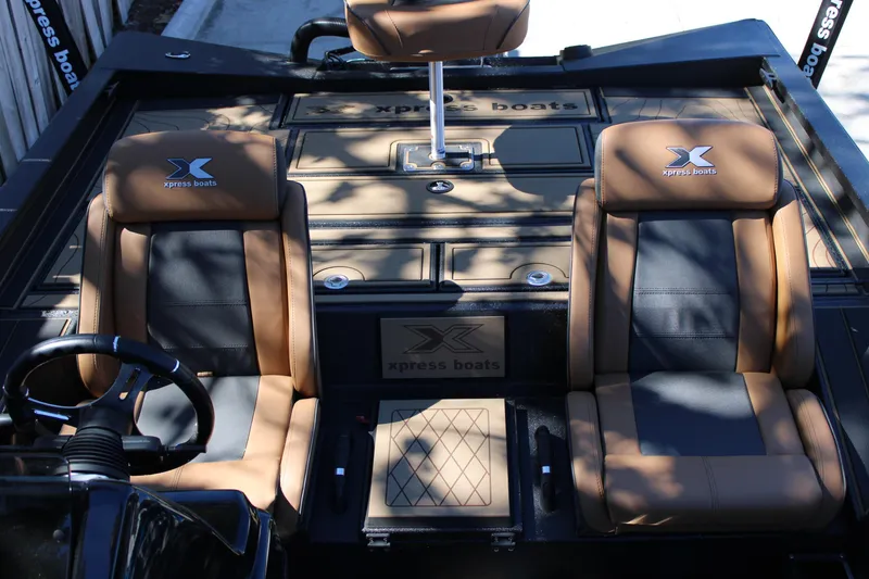 Slide: The Image of Xpress X21 Pro 2026 boat interior with dual seats and steering wheel. - 7