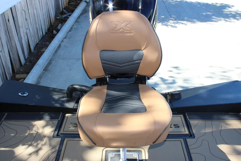 Slide: The Image of Xpress X21 Pro 2026 boat seat with tan and black design. - 8