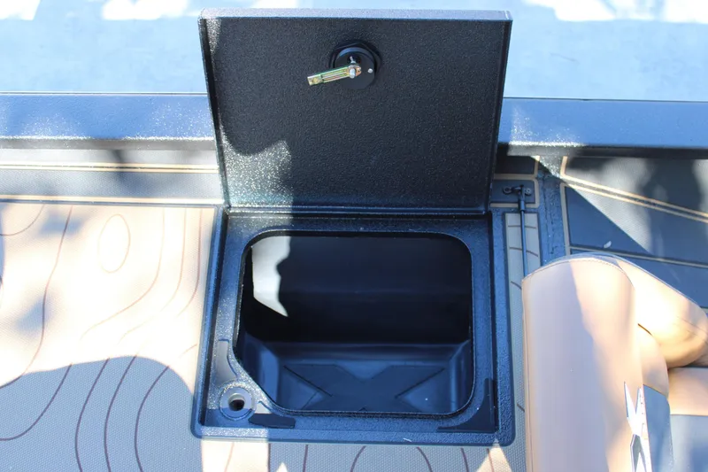 Slide: The Image of Open storage compartment on 2026 Xpress X21 Pro boat deck. - 9