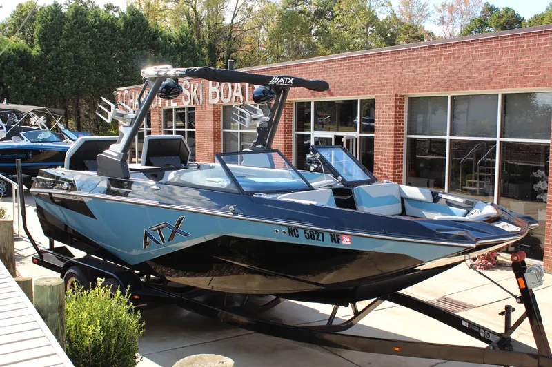 The Image of 2024 ATX Surf Boats 22 Type-S in showroom, sleek design, blue and black color scheme. - 1