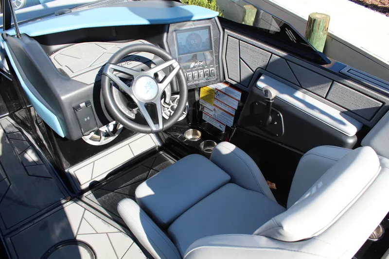 Slide: The Image of 2024 ATX Surf Boats 22 Type-S cockpit with modern steering and digital controls. - 10