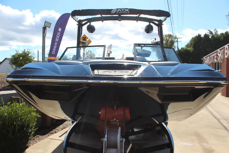 Slide: The Image of 2024 ATX Surf Boats 22 Type-S, sleek design, displayed outdoors under clear sky. - 17