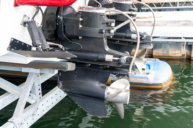 Slide: The Image of 2000 Baja 36 Outlaw boat propellers and stern drive in marina. - 19