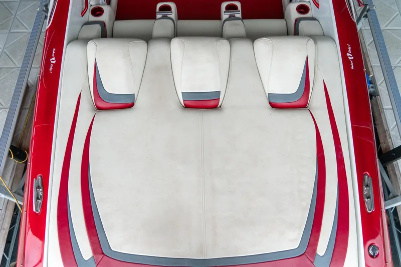 Slide: The Image of 2000 Baja 36 Outlaw boat interior with red and white upholstery design. - 24