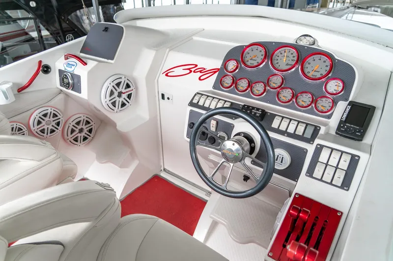 Slide: The Image of Interior cockpit of 2000 Baja 36 Outlaw boat with gauges and steering wheel. - 32