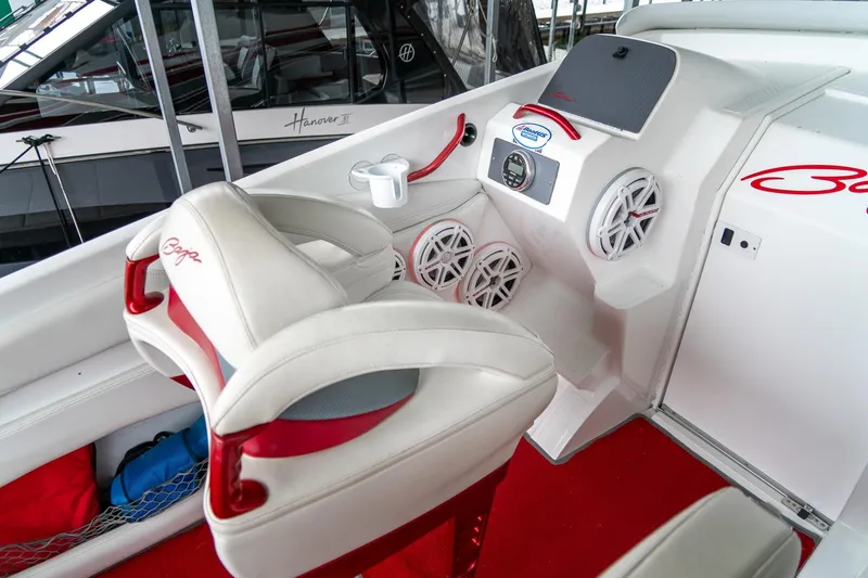 Slide: The Image of Interior of a 2000 Baja 36 Outlaw boat with white and red seating. - 34