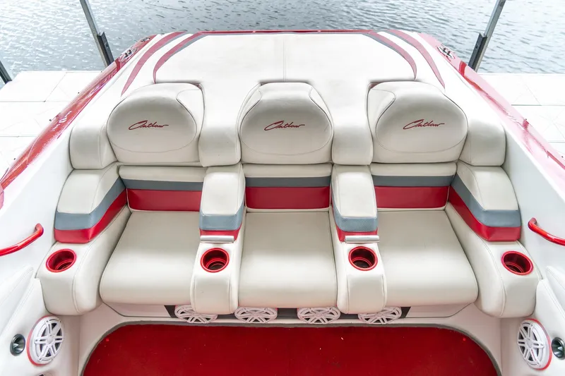 Slide: The Image of Interior seating of a 2000 Baja 36 Outlaw boat with red and white upholstery. - 38