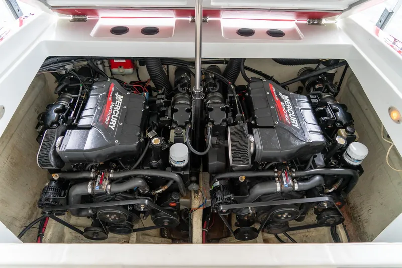 Slide: The Image of Twin Mercury engines in a 2000 Baja 36 Outlaw boat engine compartment. - 52