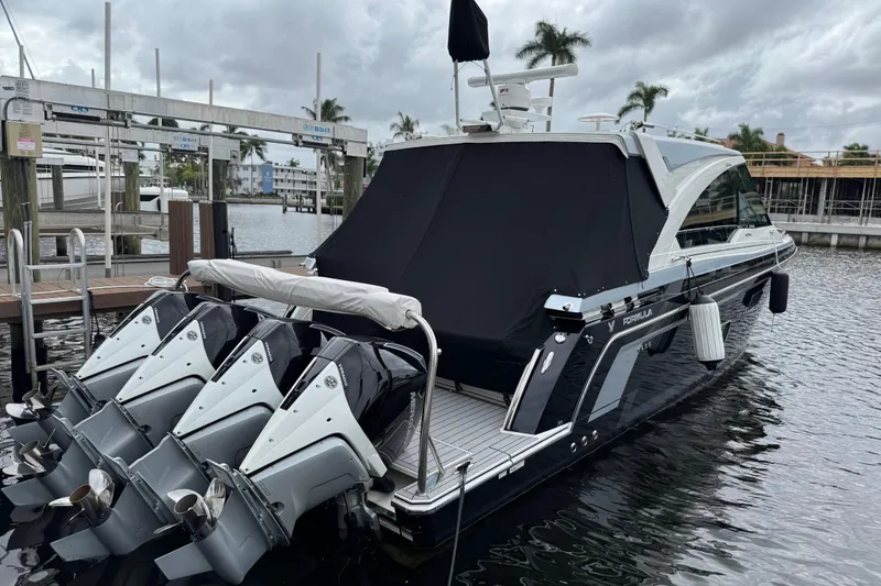 The Image of 2023 Formula 400 Super Sport Crossover docked with four powerful outboard engines. - 0