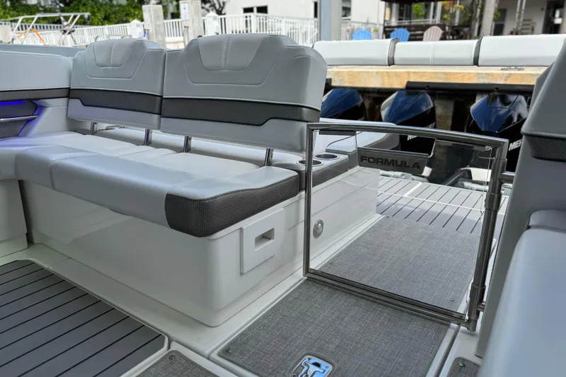 Slide: The Image of 2023 Formula 400 Super Sport Crossover boat interior with sleek seating and modern design. - 13