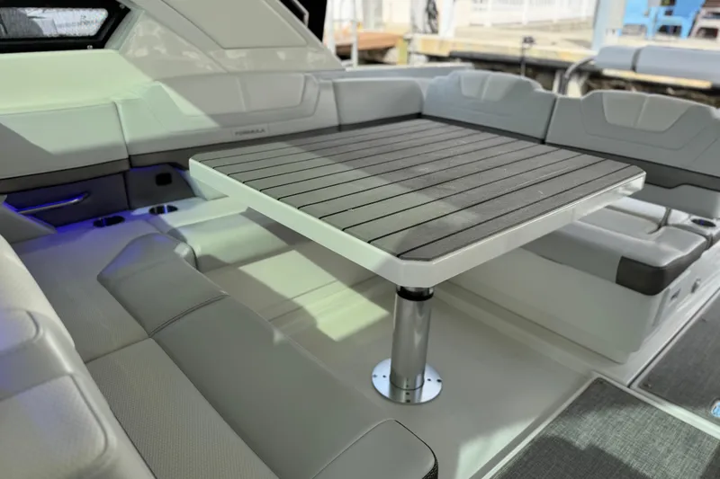 Slide: The Image of 2023 Formula 400 Super Sport Crossover interior with sleek seating and modern table design. - 17