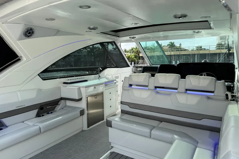 Slide: The Image of 2023 Formula 400 Super Sport Crossover interior with luxurious seating and modern amenities. - 19