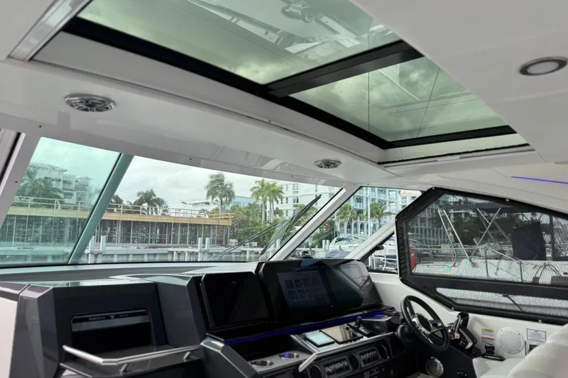 Slide: The Image of Interior view of 2023 Formula 400 Super Sport Crossover yacht cockpit with modern controls. - 29