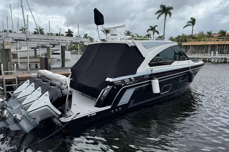 Slide: The Image of 2023 Formula 400 Super Sport Crossover yacht docked in marina, overcast sky. - 3