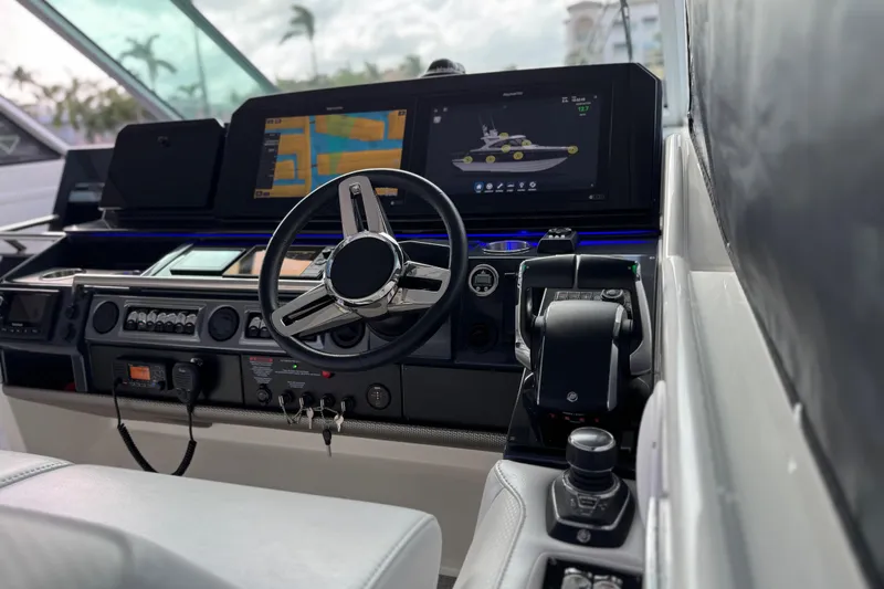 Slide: The Image of 2023 Formula 400 Super Sport Crossover helm with advanced navigation displays and controls. - 32