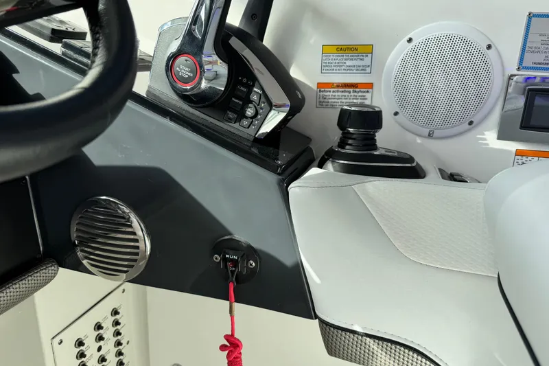 Slide: The Image of 2023 Formula 400 Super Sport Crossover helm with controls and speaker. - 33