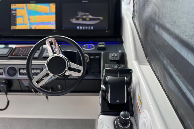 Slide: The Image of 2023 Formula 400 Super Sport Crossover helm with modern navigation displays and controls. - 34