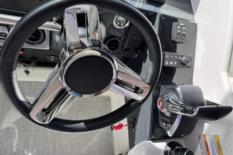 Slide: The Image of 2023 Formula 400 Super Sport Crossover steering wheel and control panel. - 35