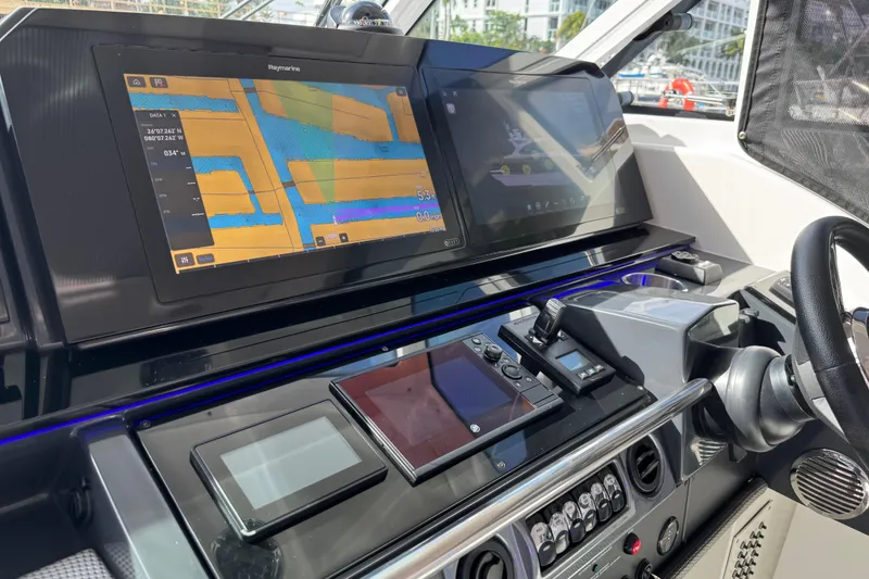 Slide: The Image of Dashboard of 2023 Formula 400 Super Sport Crossover with navigation screens and controls. - 36