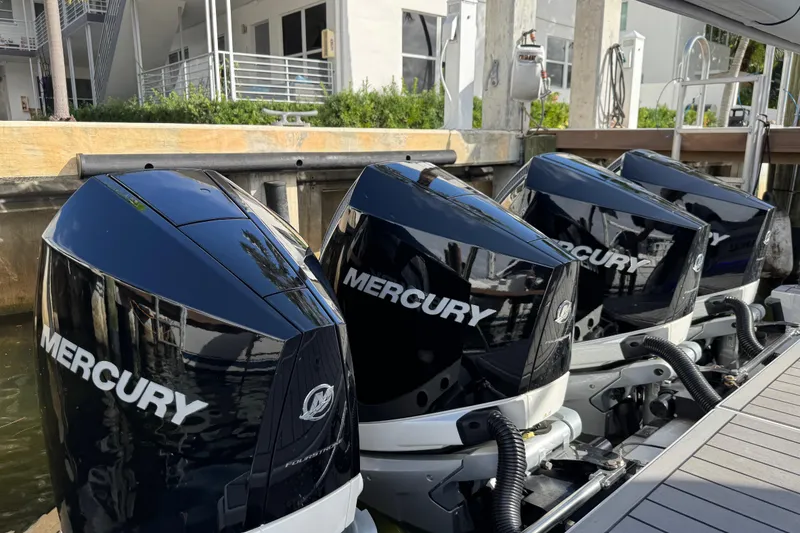 Slide: The Image of Four Mercury outboard engines on a 2023 Formula 400 Super Sport Crossover boat. - 4