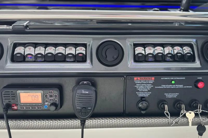 Slide: The Image of Control panel of 2023 Formula 400 Super Sport Crossover boat with switches and communication device. - 40