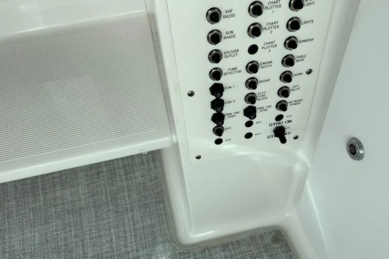 Slide: The Image of Control panel of 2023 Formula 400 Super Sport Crossover boat with various switches. - 45
